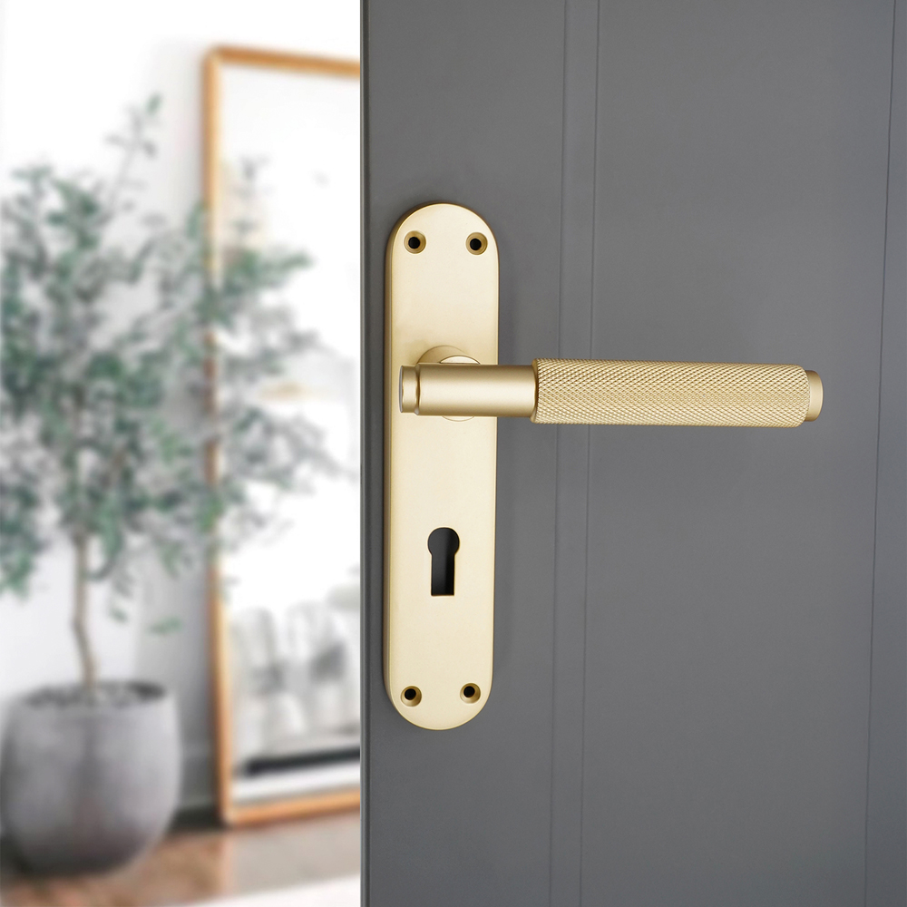 Spira Brass Connaught Satin Brass Knurled Lever Door Handle with Lock Backplate 2 Pack Image 2